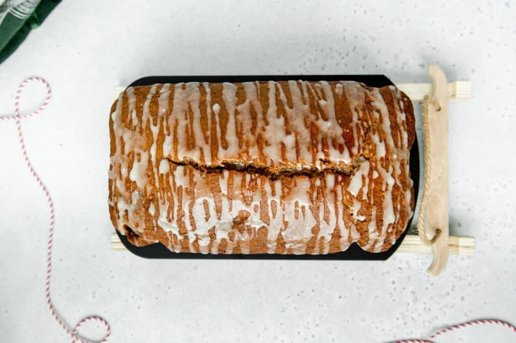 Overhead photo of a gingerbread loaf on a sled.