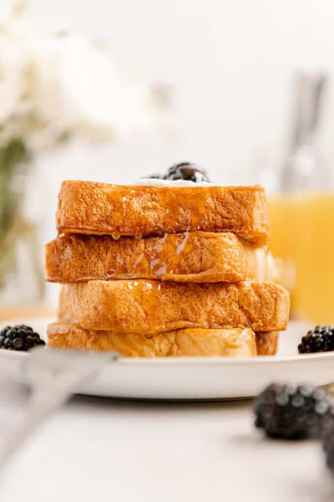 Stack of four vegan French toasts made with Just Egg on top of one another.