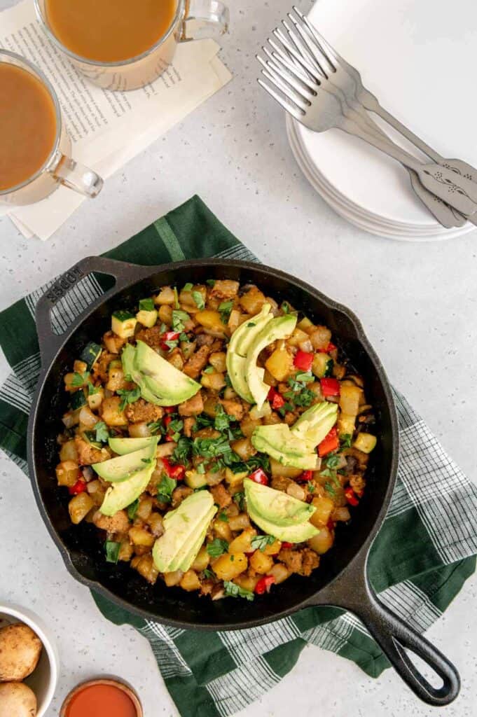 Overhead of a vegan breakfast hash in a cast iron skillet.