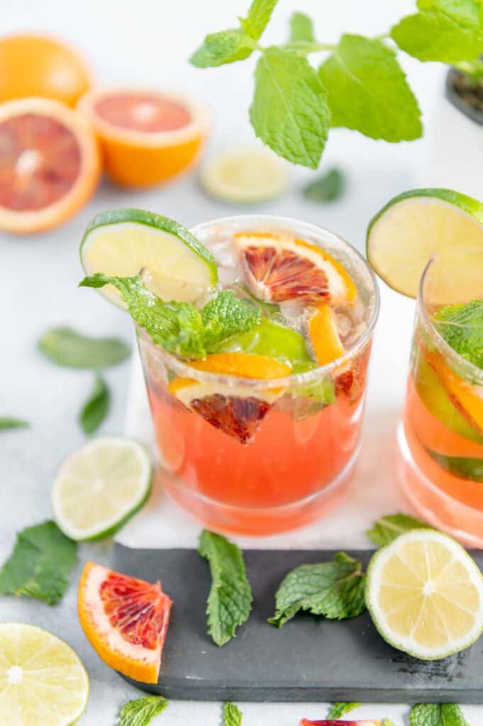 Two refreshing cocktails on a serving tray.