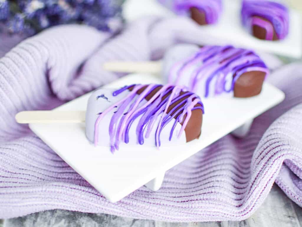 Upclose of an ice cream bar dipped in chocolate.