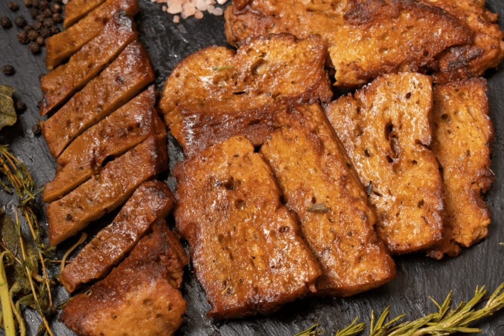 Sliced and seasoned seitan.