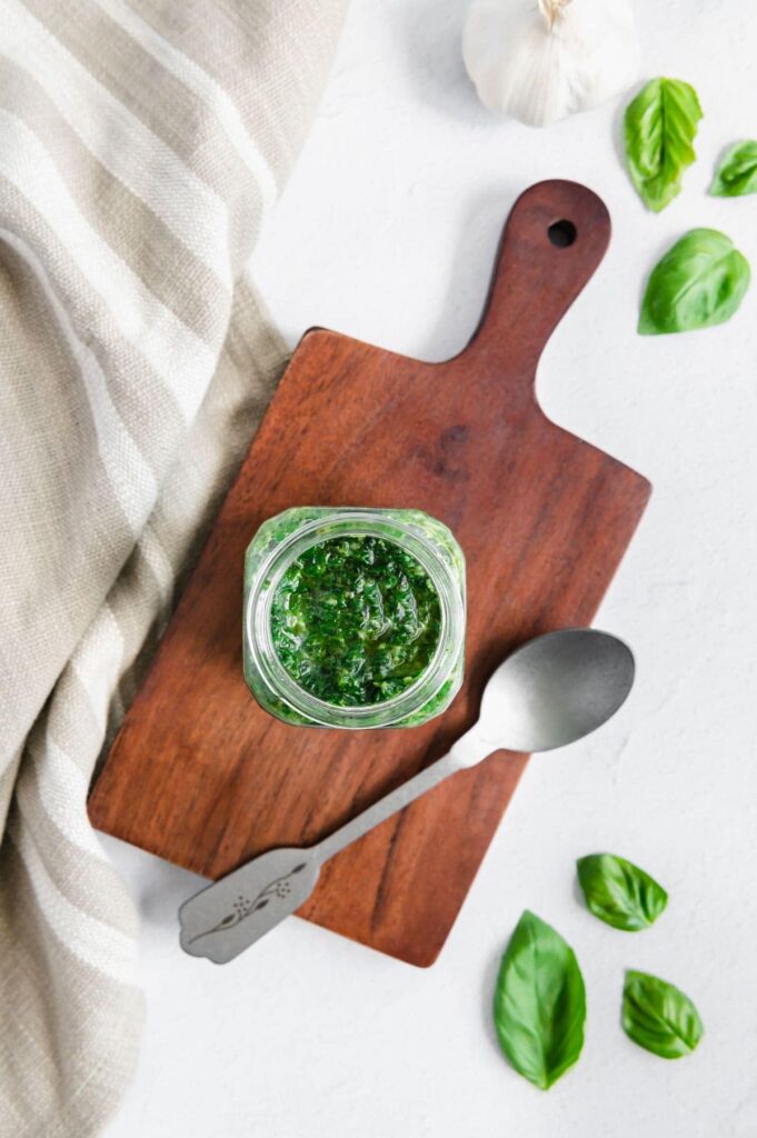 Overhead of an allergy friendly pesto on a wood tray.