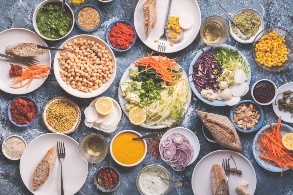 A huge spread of different vegan dishes on a table.