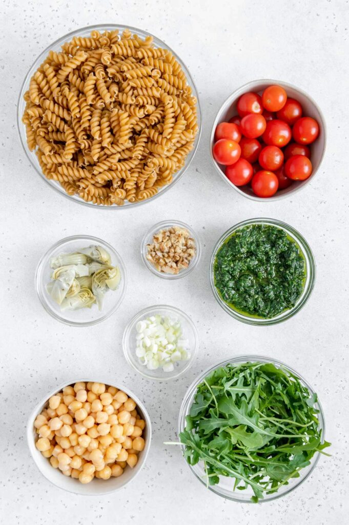 Ingredients of a vegan pesto pasta salad.