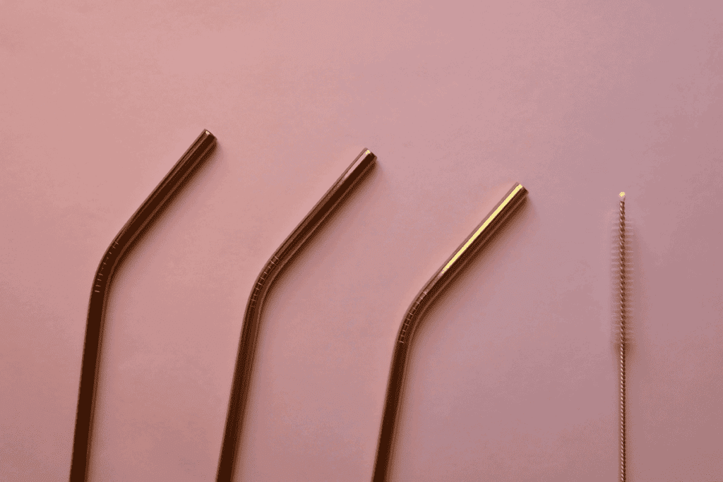 Three reusable copper straws.