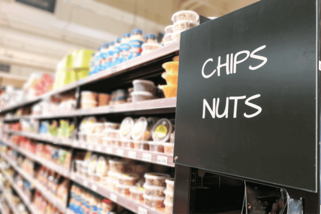 The chips and nut aisle in a grocery store.