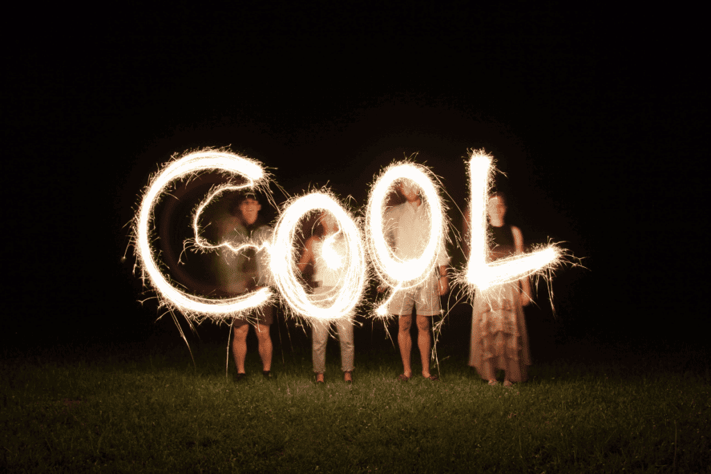 People spelling out "COOL" in sparklers.