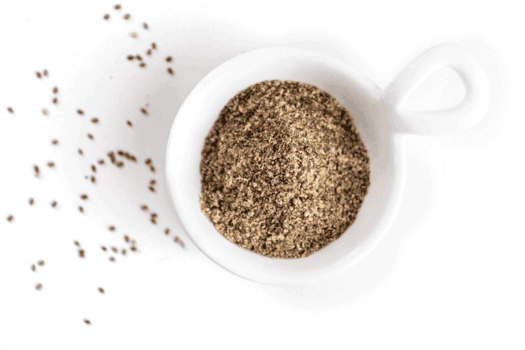Ground flax seeds in a measuring cup.