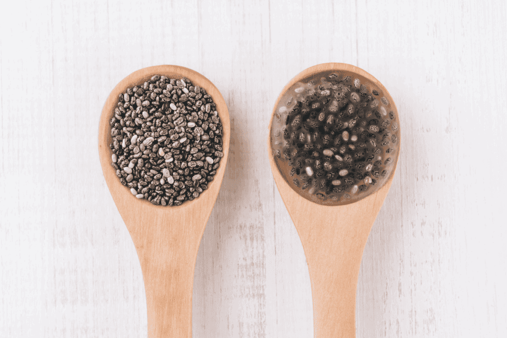 A teaspoon with dry chia seeds and a chia seed egg.