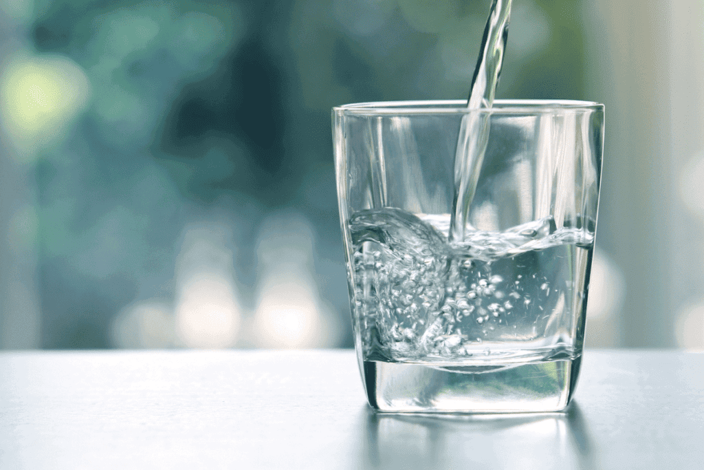 Water being poured into a glass.