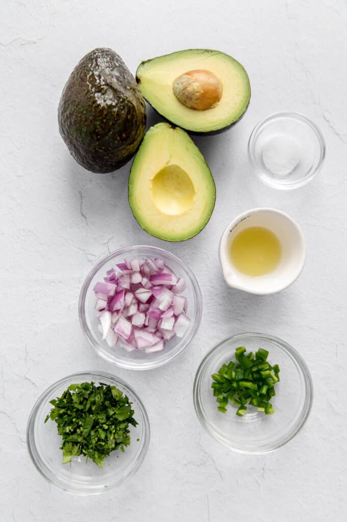 Ingredients to make the classic Chipotle guacamole.