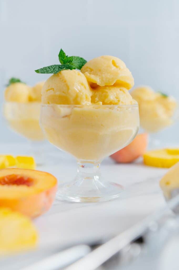 Vegan tropical sorbet made with peaches and pineapple.