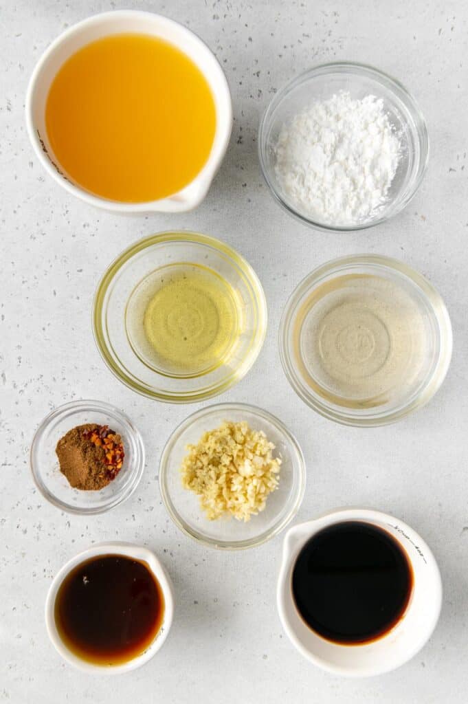 Ingredients in bowls to make orange tofu sauce.