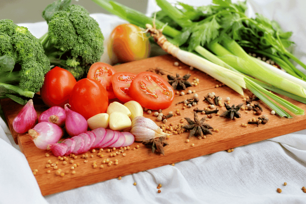 A chopping board full of fresh veggies.