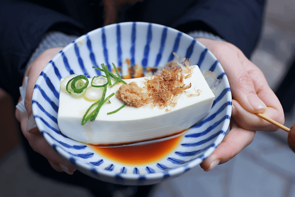 Silken tofu in a blue bowl.