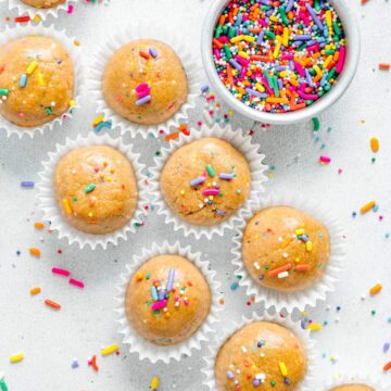 Cake bites in mini muffin liners with sprinkles.
