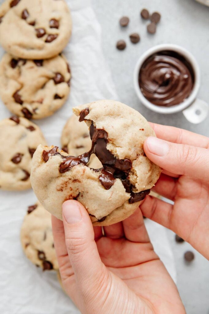 A Nutella cookie oozing out with Nutella.