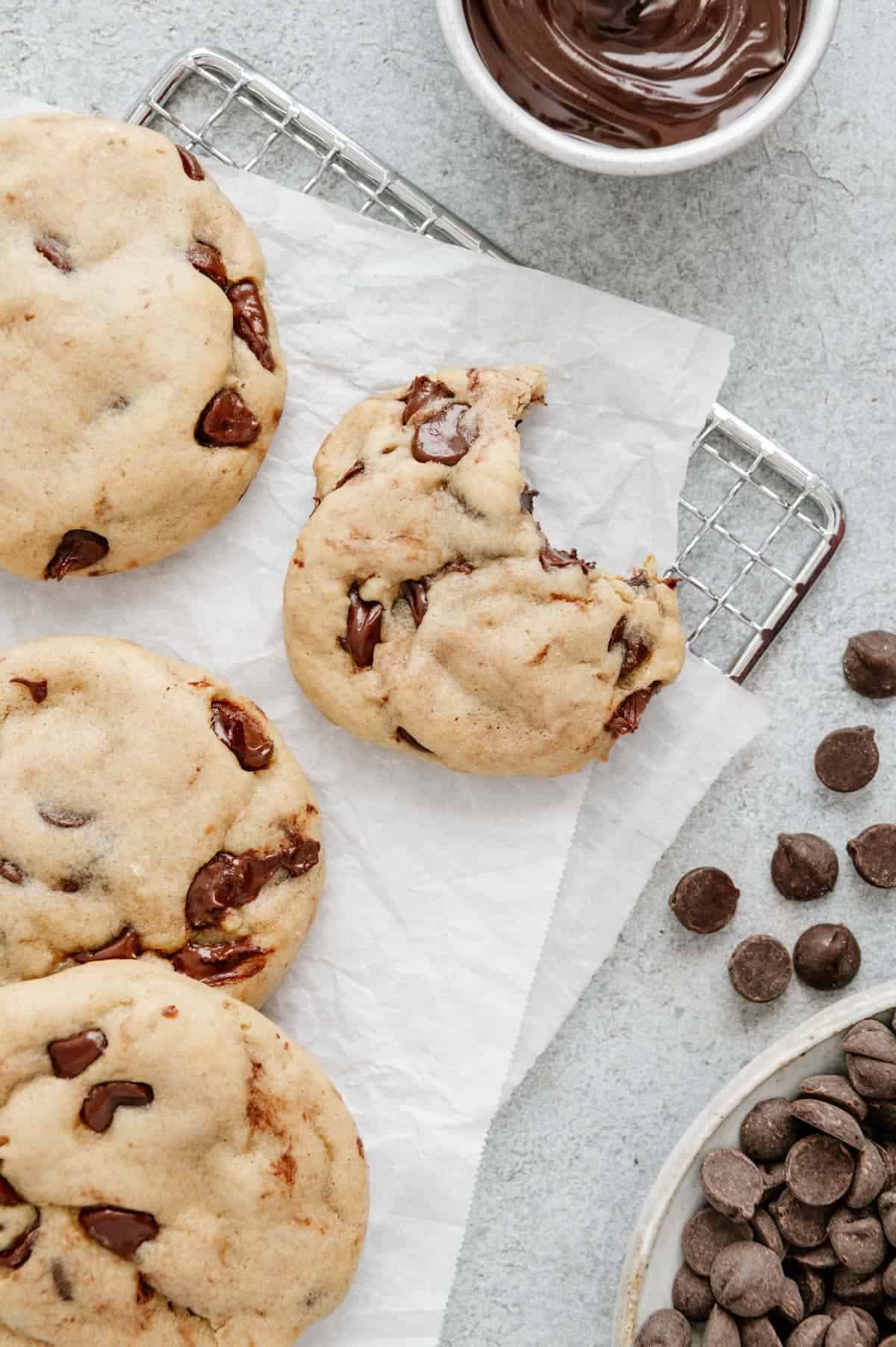 A vegan Nutella stuffed cookie with a bite taken out of it.