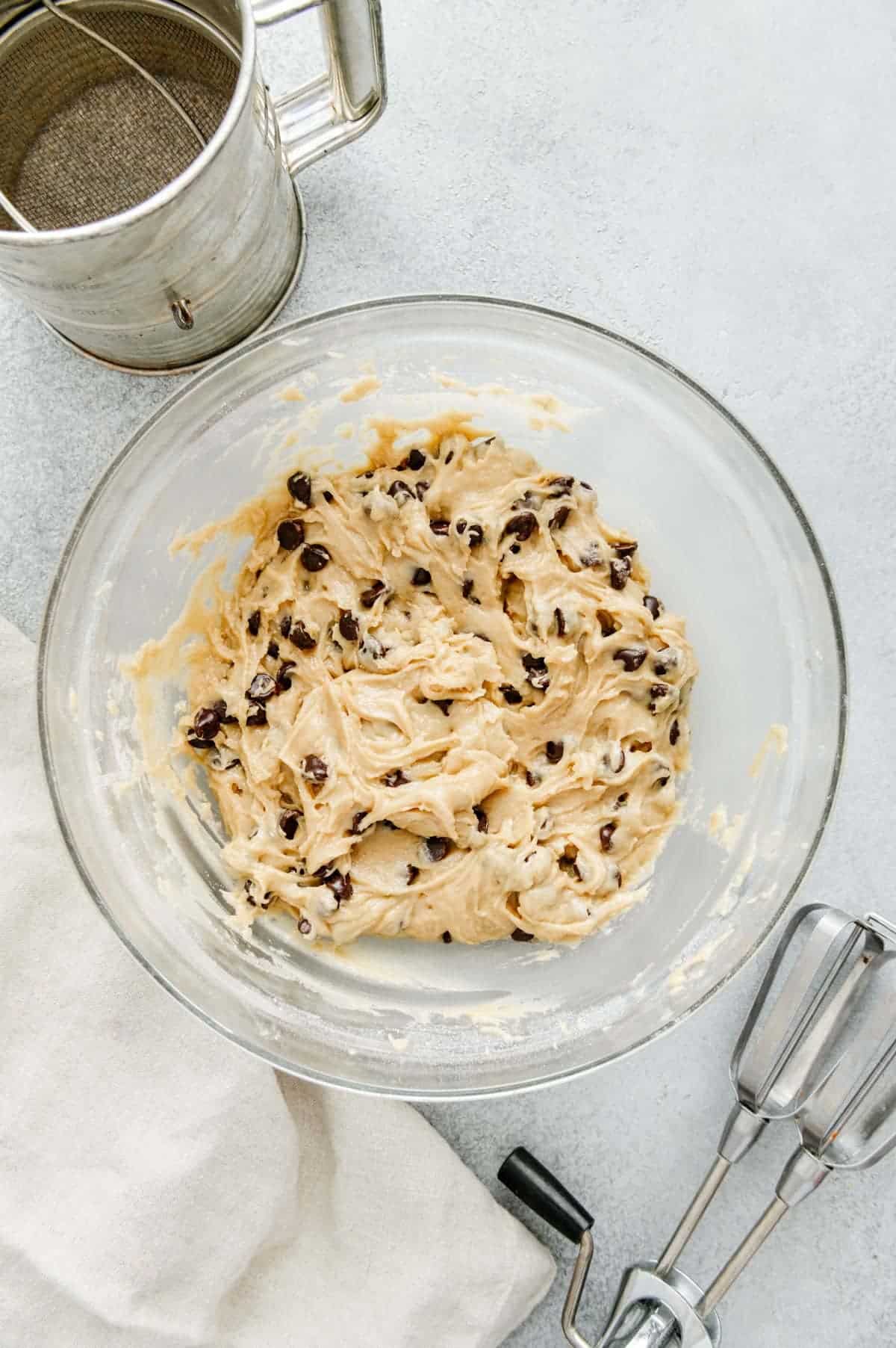 Chocolate chips folded into cookie batter.