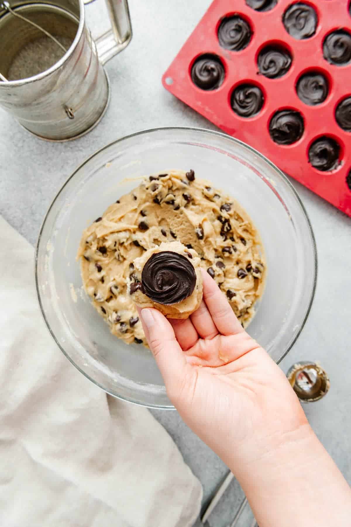 Nutella disc placed on top of cookie dough.