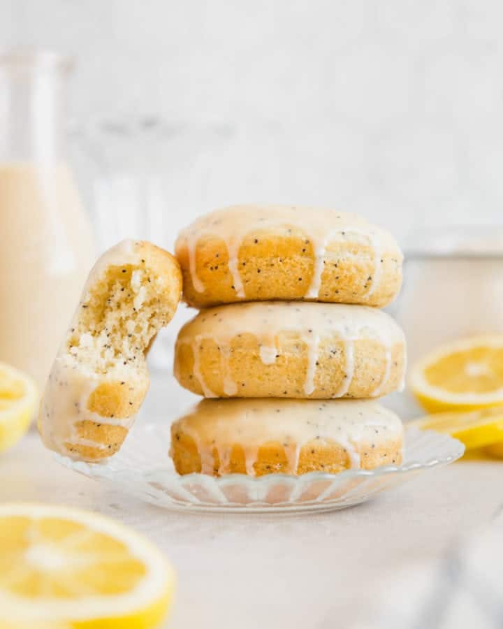 A stack of baked crumb-y lemon donuts.