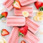 Popsicles with fresh strawberries and bananas.