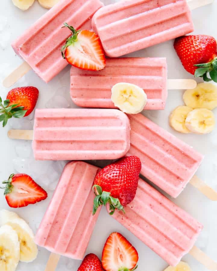 Popsicles with fresh strawberries and bananas.