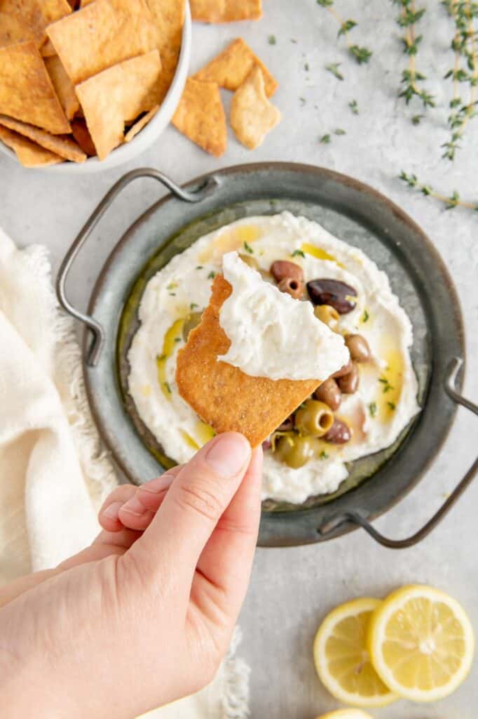 A crunchy pita chip dipped in whipped feta.