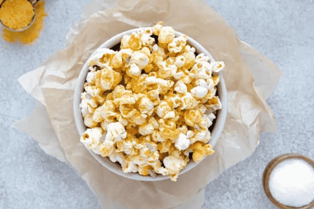 Popcorn with nutritional yeast sprinkled overtop.