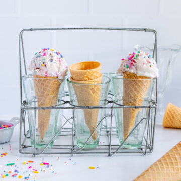 Ice cream cones in small glasses.