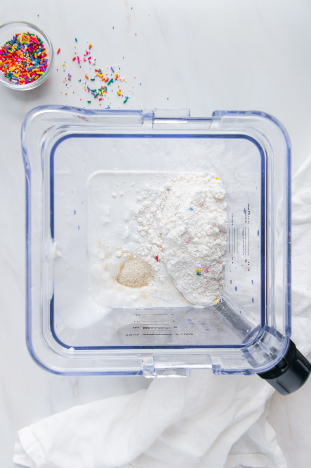 Ingredients to make vegan cake batter ice cream in a blender.