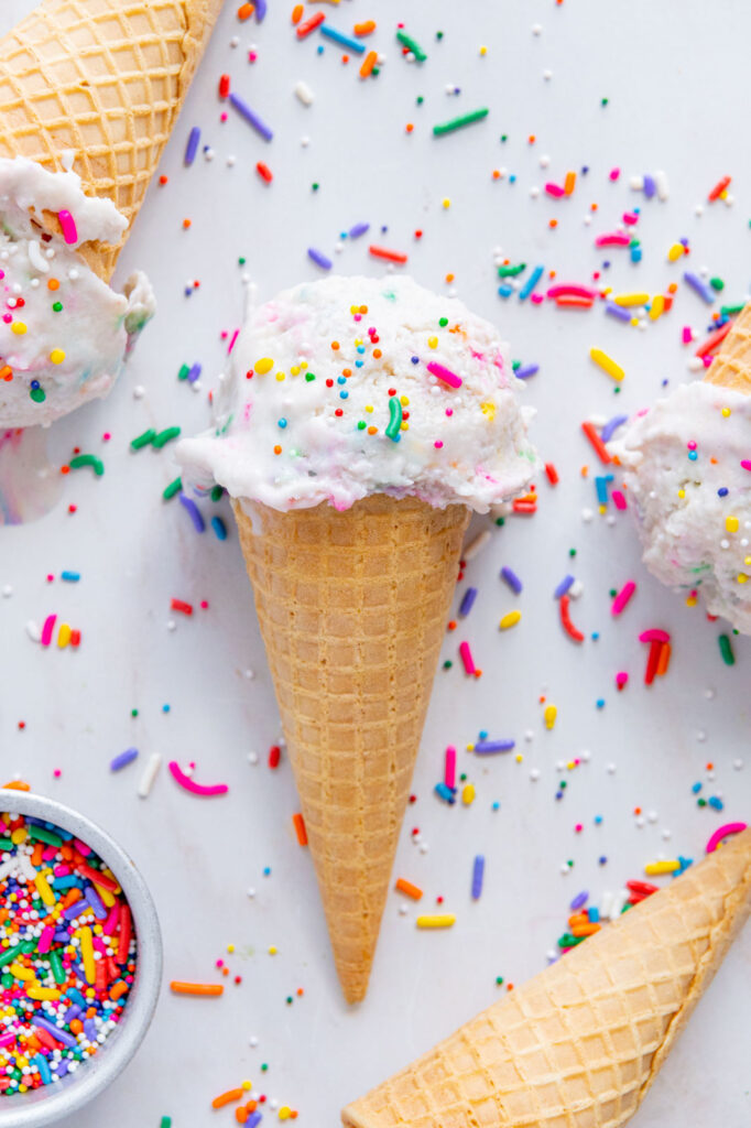Vegan funfetti ice cream cone with sprinkles.