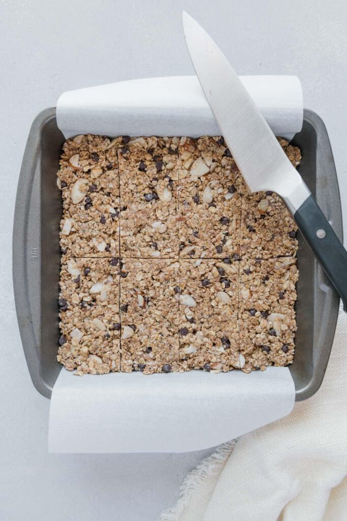 Granola bars after setting in the refrigerator sliced into bars.