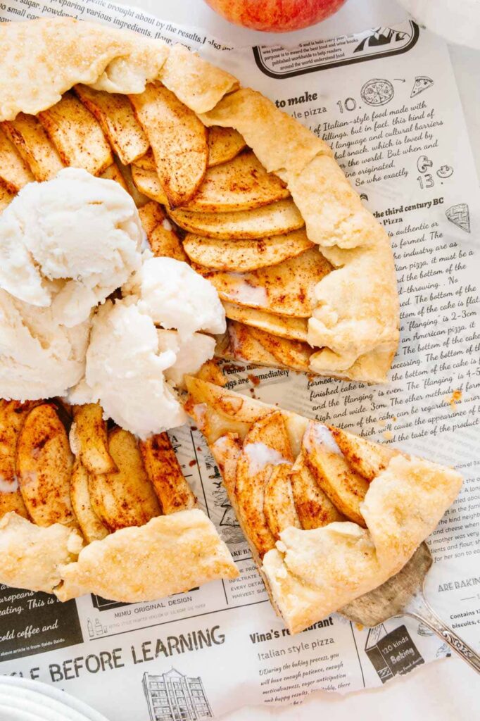 An slice of apple galette with vanilla ice cream.