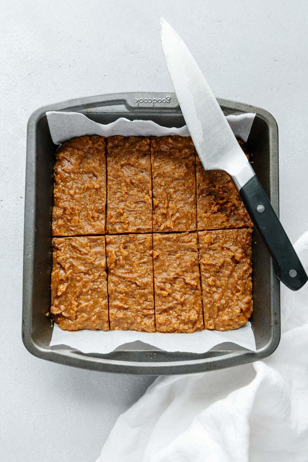 The filling of homemade Butterfingers cut into bars.