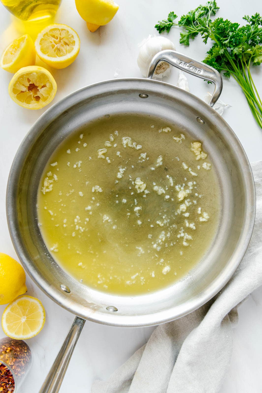Garlic, butter, and olive oil in a saucepan.