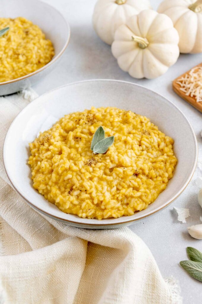 Pumpkin risotto with white pumpkins and vegan parmesan cheese.