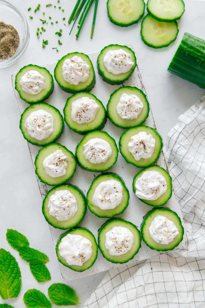 Cucumber bites appetizer on a serving plate.