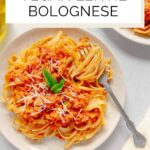 Vegan Red Lentil Bolognese Sauce Pinterest graphic with imagery and text.