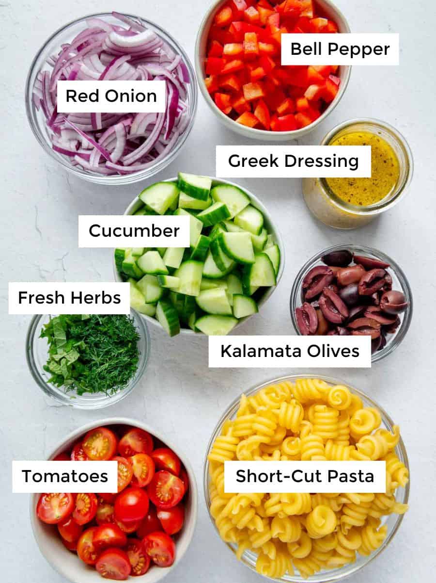 Labeled ingredients to make a Mediterranean Pasta Salad.