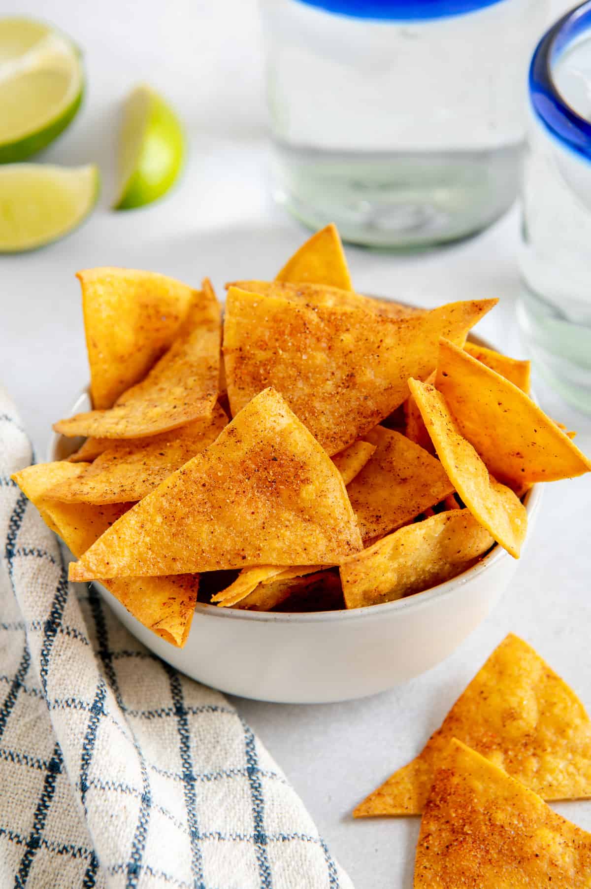 A serving bowl full of spiced homemade tortilla chips.