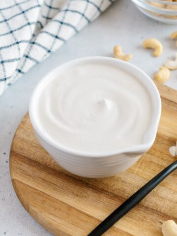 Creamy homemade cashew cream in a small bowl,